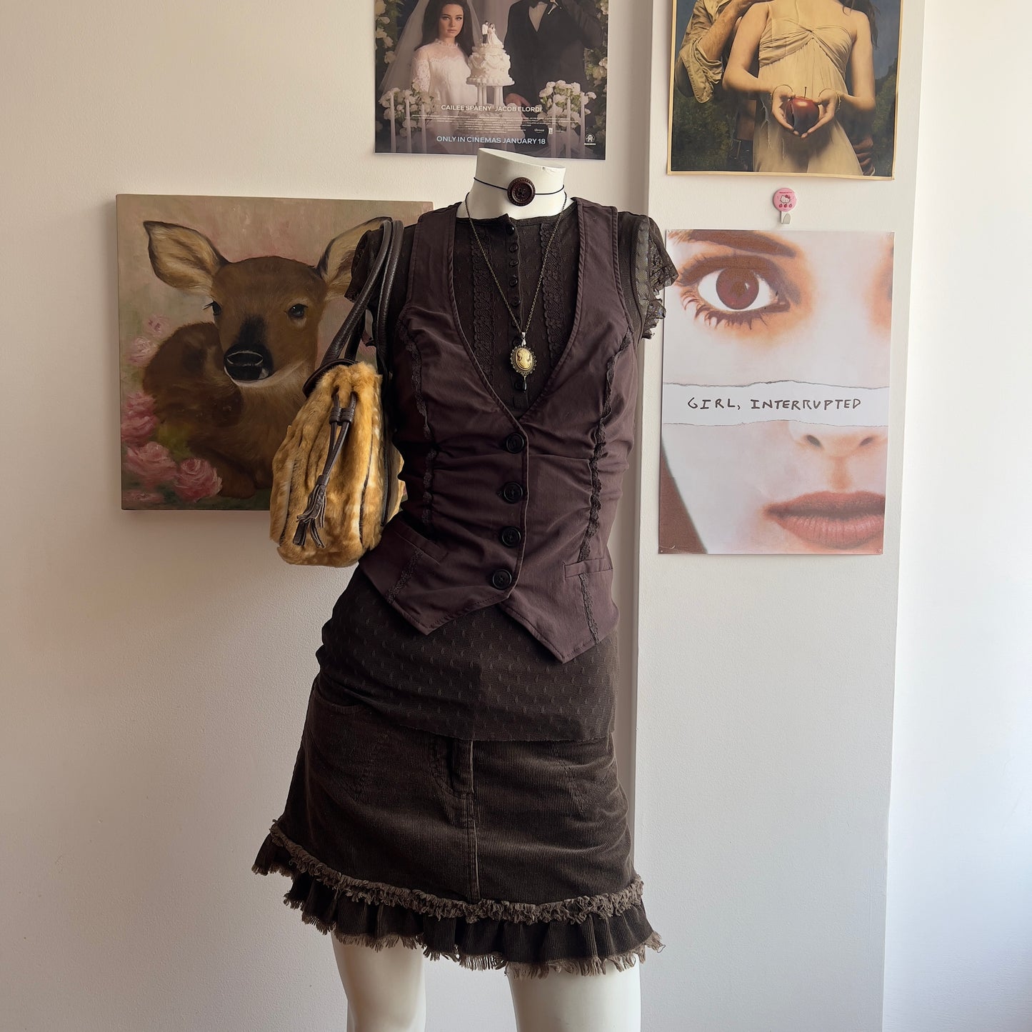 2000s horror game protagonist brown vest with lace details