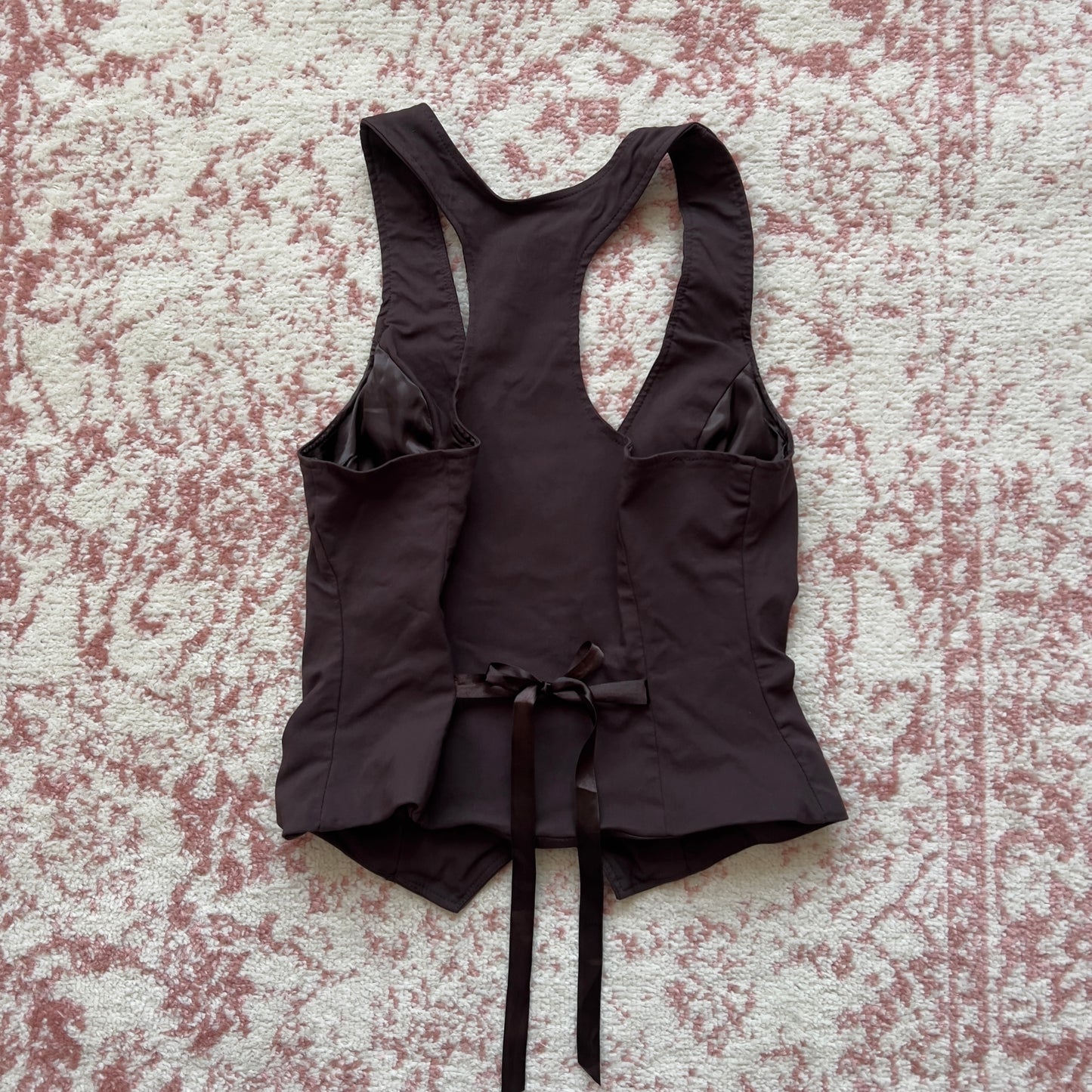 2000s horror game protagonist brown vest with lace details